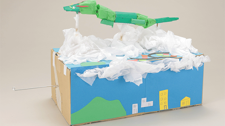 町の上を飛ぶ竜